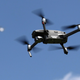A drone and airplane share the sky over Bethpage State Park on May 7, 2020 in Bethpage, New York.